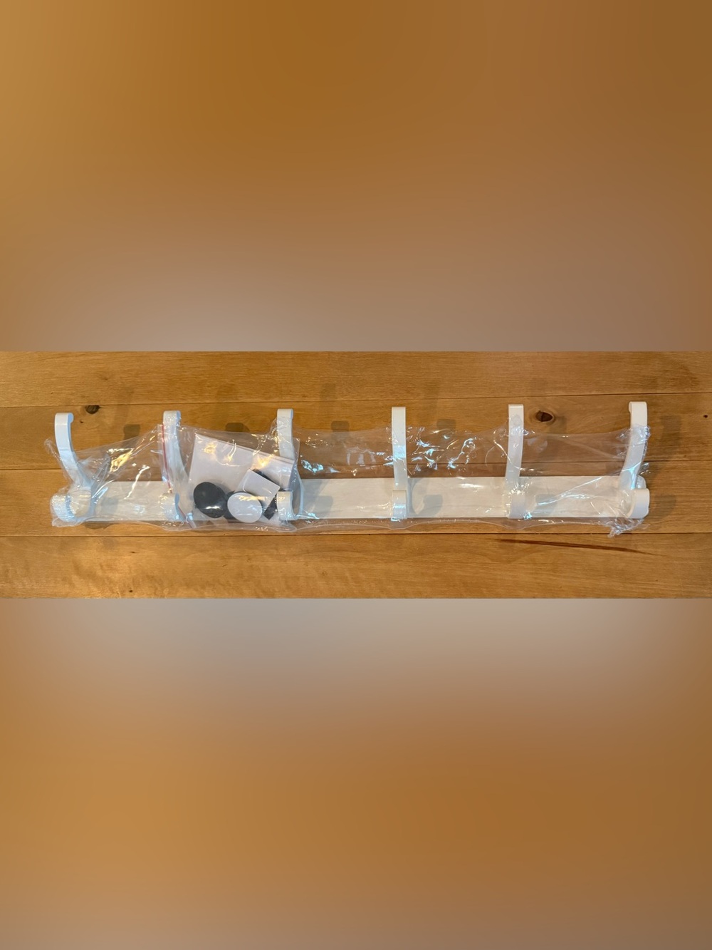 White Plastic Clothing Hanger Hooks.  17” long, 3” tall. New.